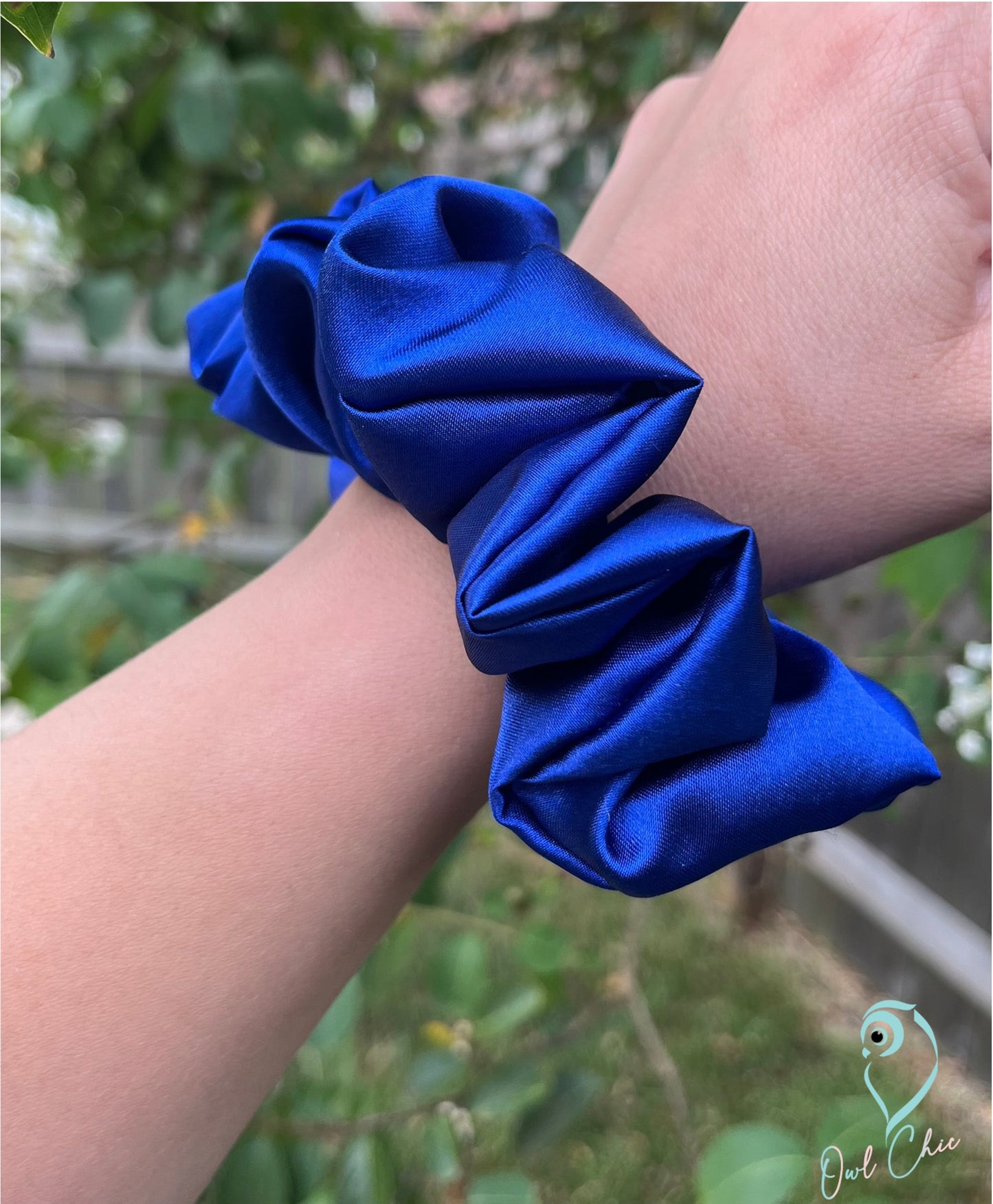 Polyester charmeuse satin scrunchie in royal blue.