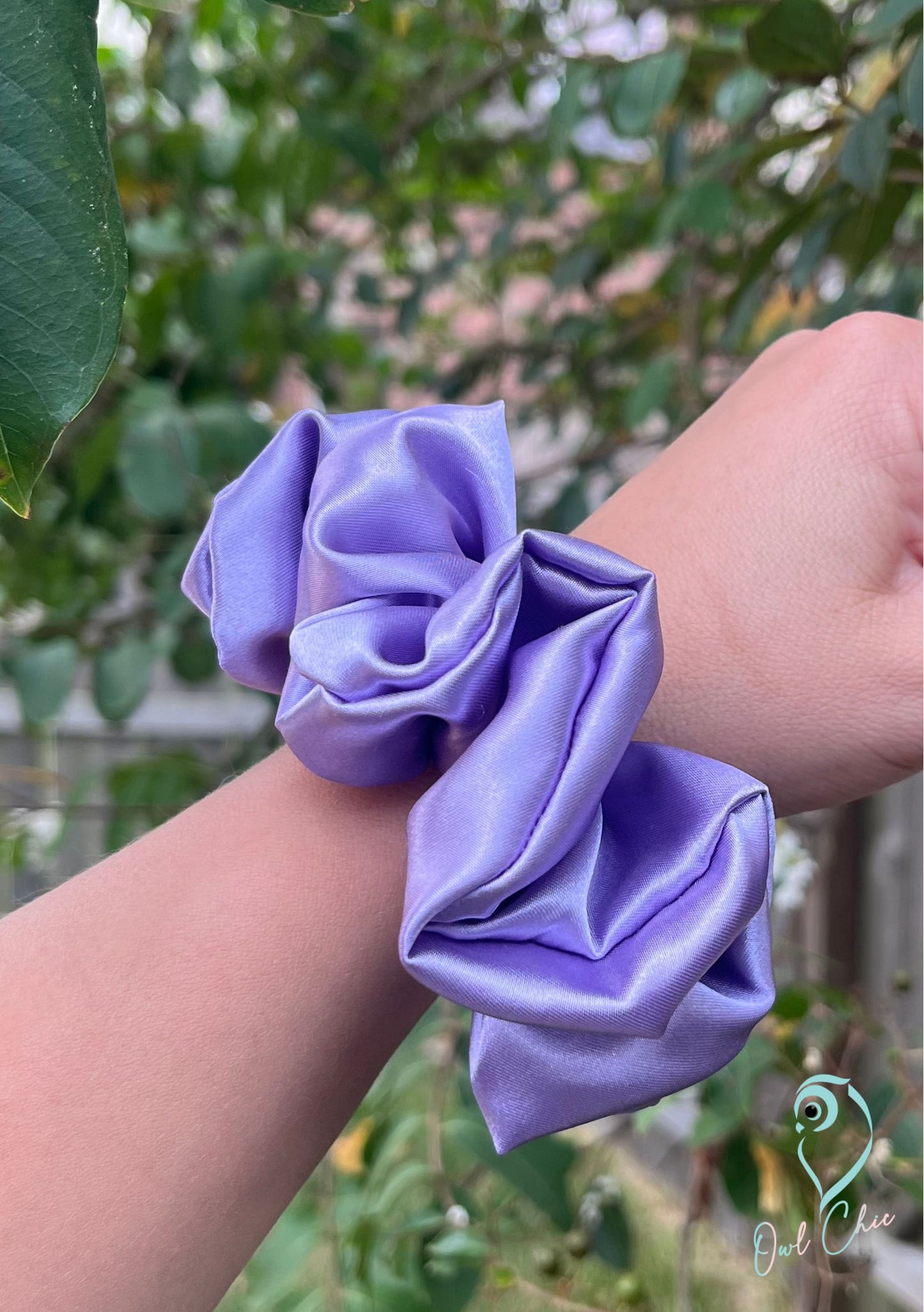 Polyester charmeuse satin scrunchie in lavender.