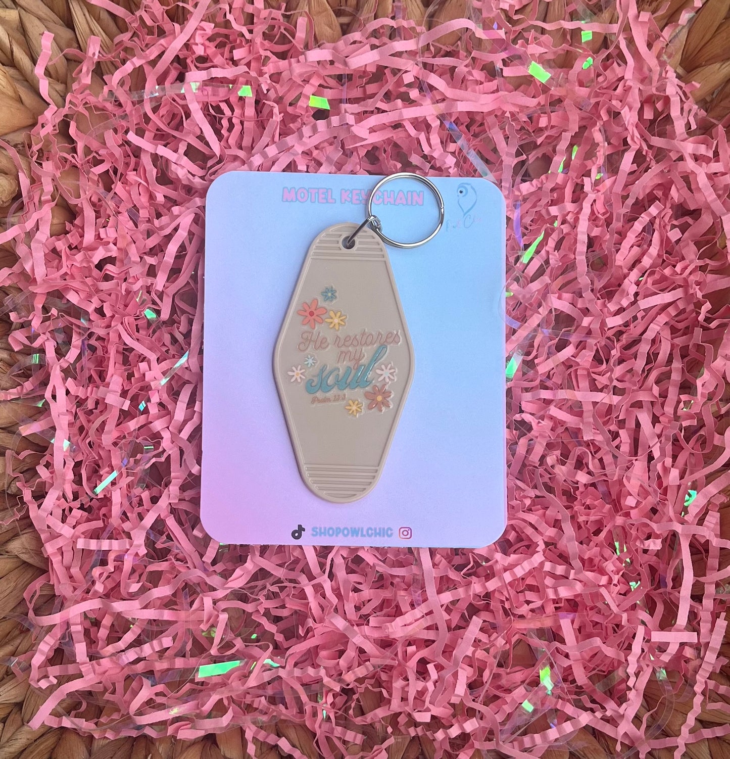 Dark tan motel keychain with Psalm 23:3 design