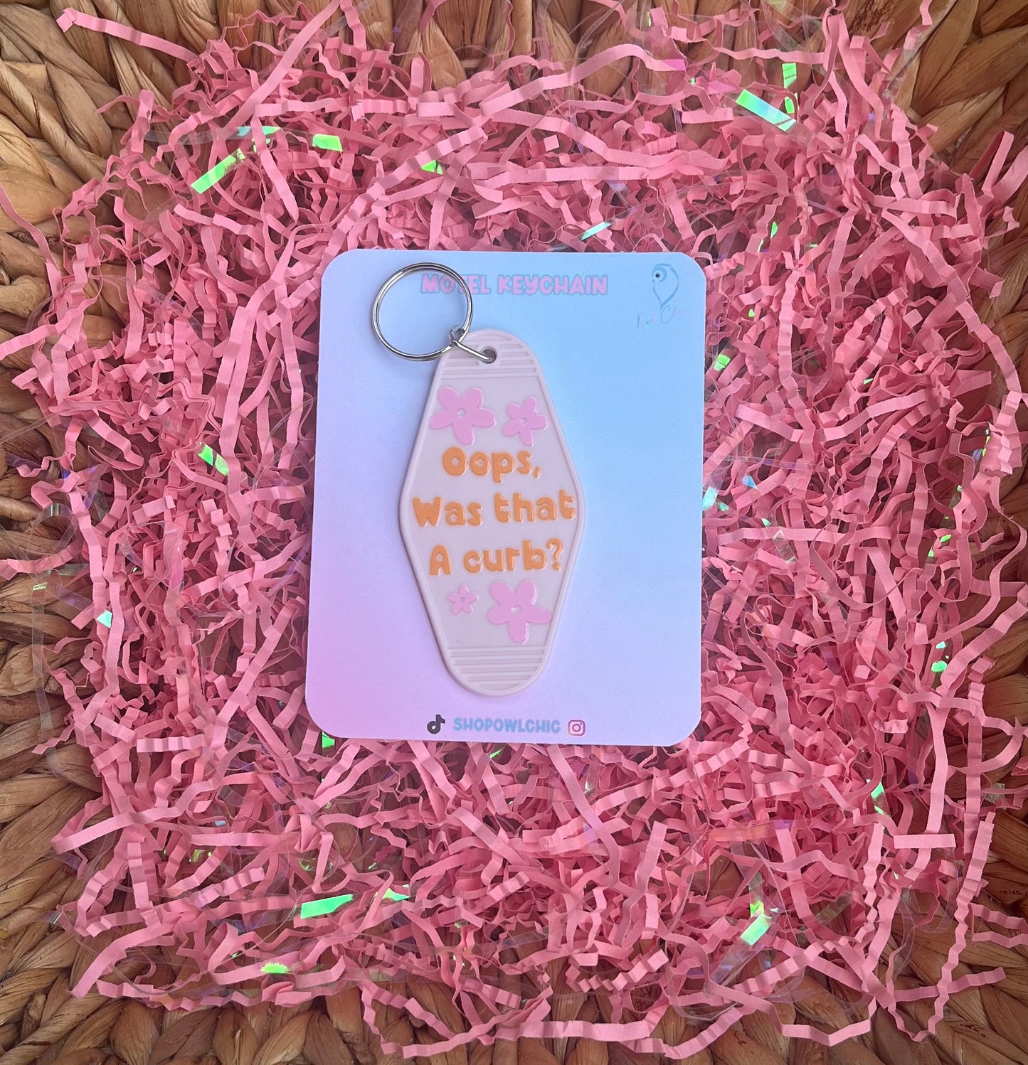 Oops, Was That a Curb? motel keychain in light pink