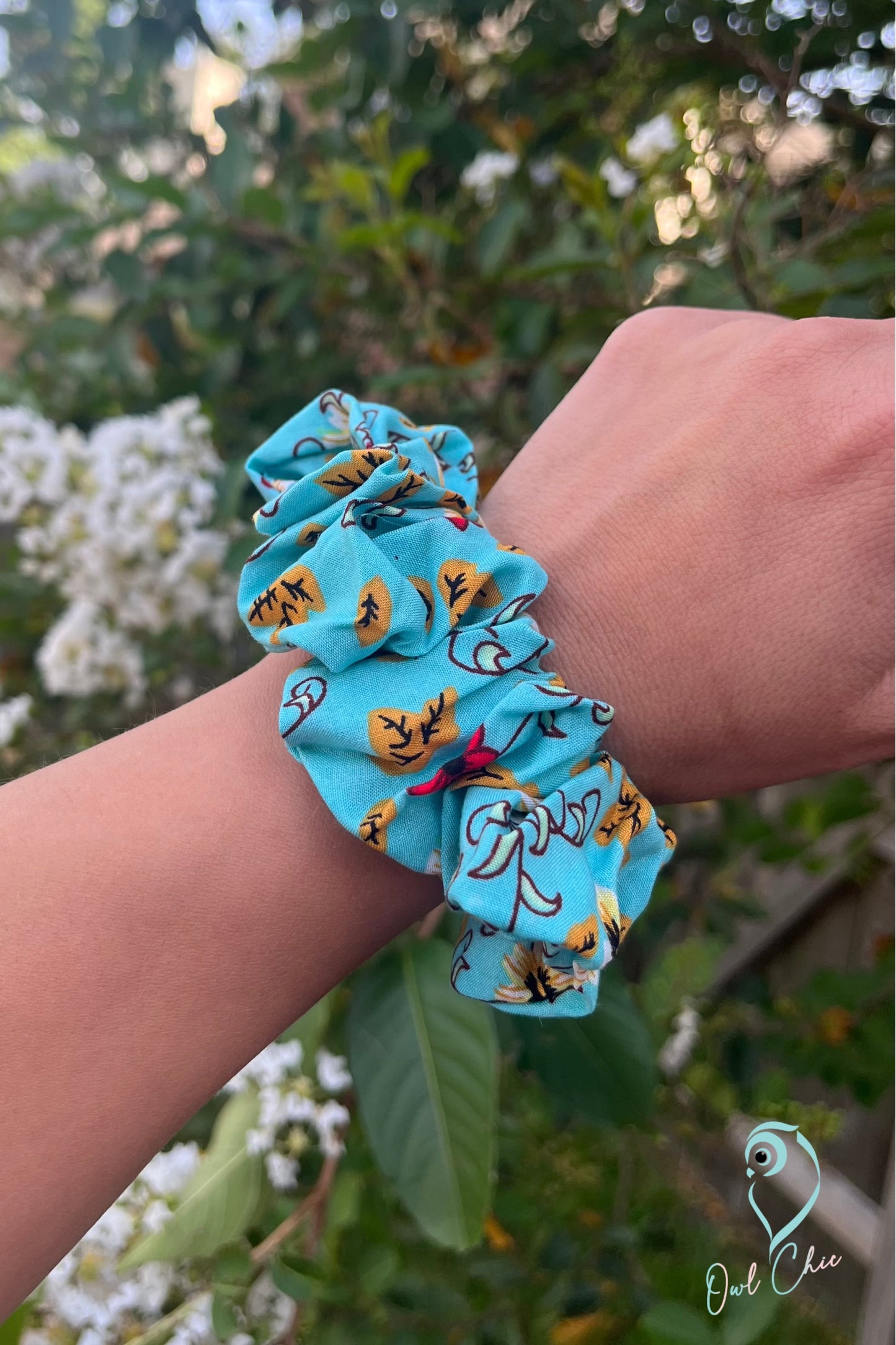 Handmade teal rayon challis scrunchie in floral pattern.