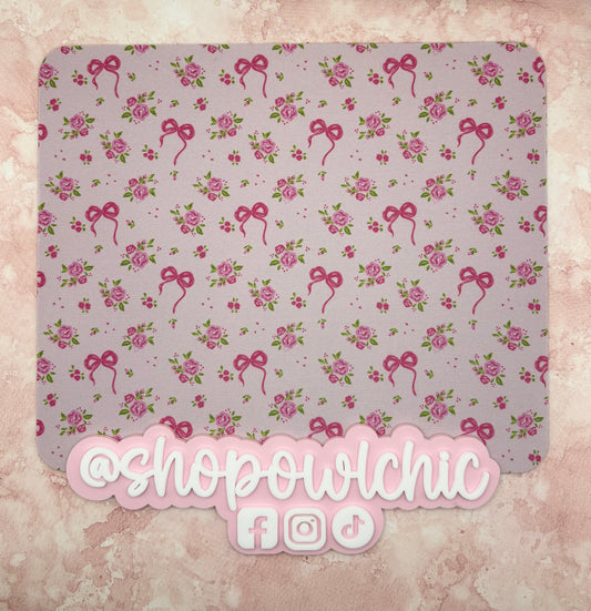 Floral and bow patterned product with 'shopowlchic' branding on a textured background