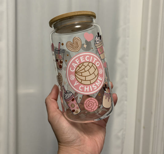 Hand holding a glass jar with Cafecito Decal 