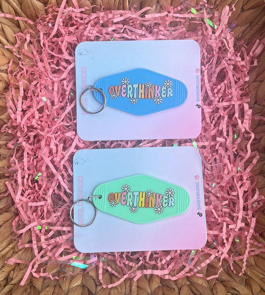 Picture of Blue and light green Motel Keychain with the saying -Overthinker